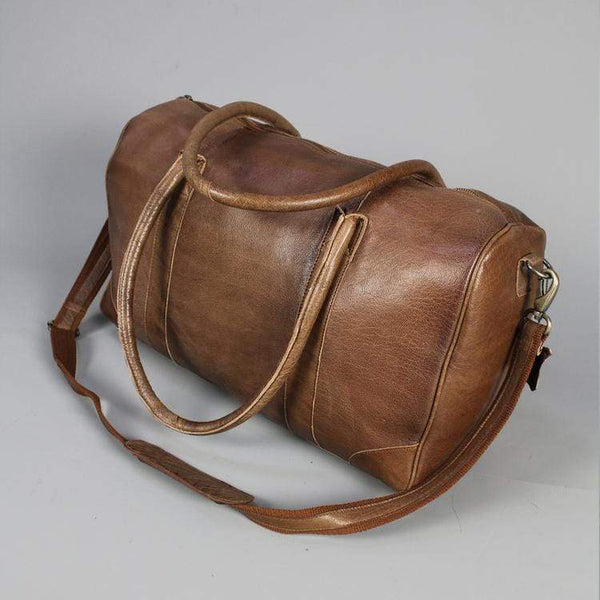 Twin handle leather holdall with strap with central zip