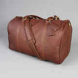 Leather holdall zip top travel bag with strap