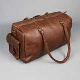 Leather holdall zip top travel bag with strap and side pockets