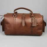 Leather holdall zip top travel bag with strap and side pockets