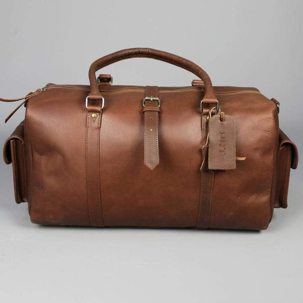 Leather holdall zip top travel bag with strap and side pockets
