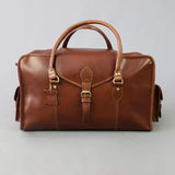Leather holdall zip top travel bag with strap and side pockets