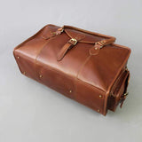 Leather holdall zip top travel bag with strap and side pockets